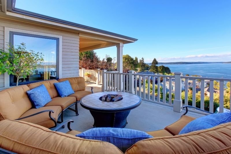 circular shaped sofa with center table in a side of the house patio